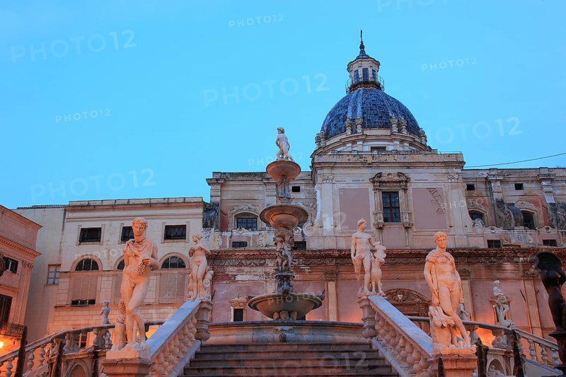 In the old town of Palermo, in Piazza Pretoria, fountain figure of the Fontana Pretoria and the church of Santa Caterina, Sicily, Italy, Europe