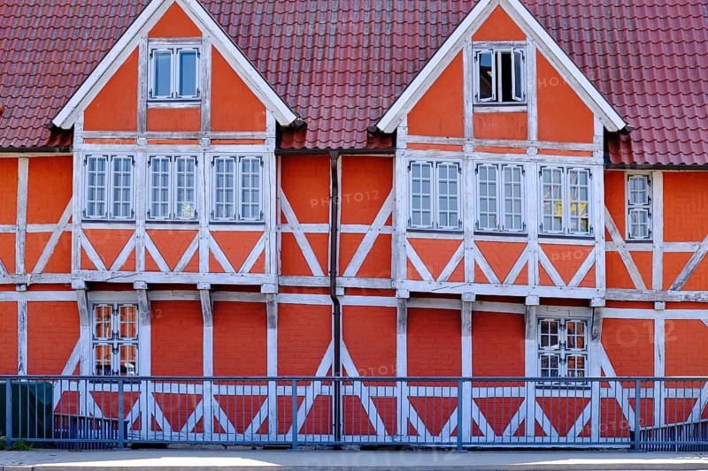 Concept and symbol image, concept of the half-timbered house, illustrated by the example of the so-called vault, a heritage-protected building over the Mühlenbach in the historic old town of the Hanseatic city of Wismar, Mecklenburg-Western Pomerania