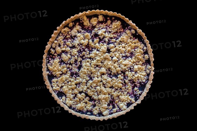 Blueberry cake with crumble on black background, Lower Saxony, Germany, Europe