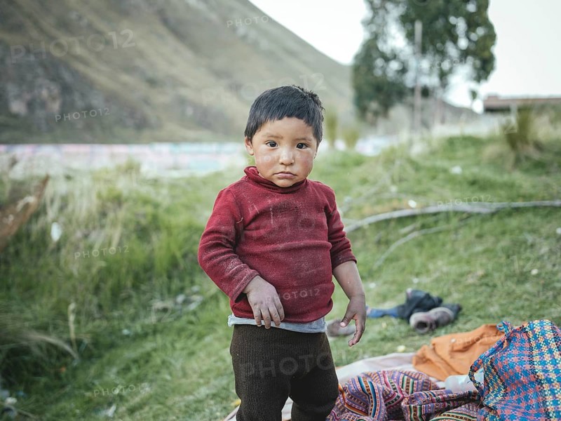 Child of a miner in an open pit kaolin mine, Pachacayo, Peru, South America
