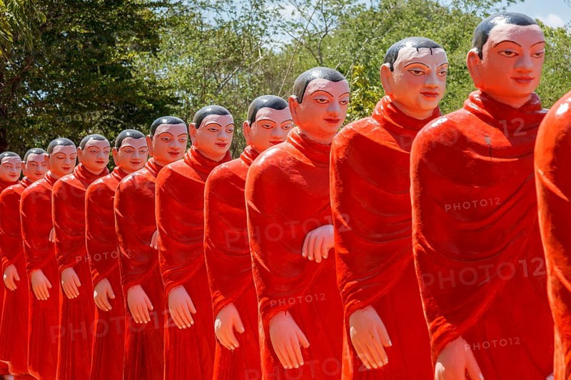 ANURADHAPURA, SRI LANKA, SEPTEMBER 26, 2009: 500 statues of Buddhist monks (Arahants) in Nellikulama Temple walking after Buddha