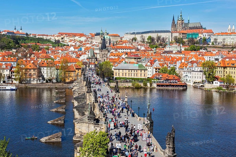 PRAGUE, CZECH REPUBLIC, APRIL 26, 2012: Charles Bridge over Vltava river crowded with tourists in Prague, Czech republic