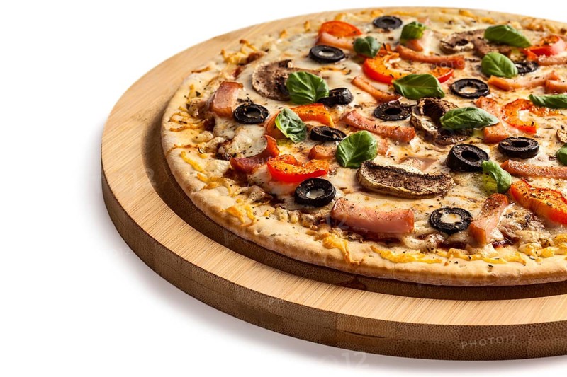 Ham pizza with (capsicum), mushrooms, olives and basil leaves isolated on white
