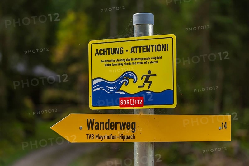 Warning sign at Stillup stream, water level, hiking trail in Stilluptal, Stillupgrund, Mayrhofen, High Alps nature park Park Zillertal Alps, Tyrol, Austria, Europe