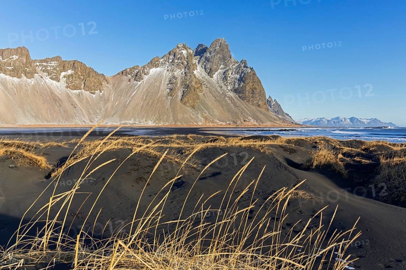 Vestrahorn, Vesturhorn, scree mountain made of gabbro and granophyre rocks, part of the Klifatindur mountain range at Stokksnes in winter, Iceland, Europe