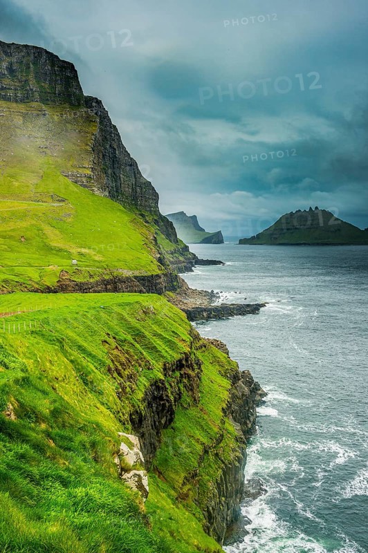 Huge cliffs in Gasadalur, Vagar, Faroe islands, Denmark, Europe