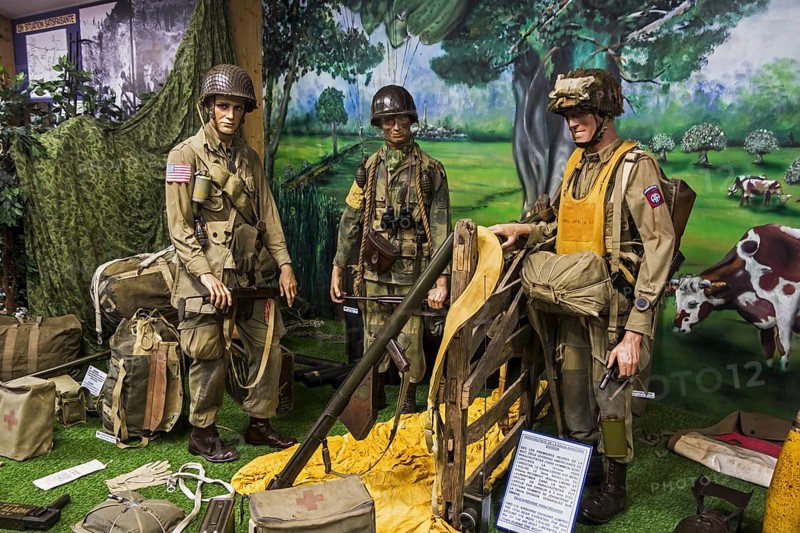 Uniforms and weapons of American airborne soldiers at the Musée Mémorial d'Omaha Beach, WW2 museum about D-Day at Saint-Laurent-sur-Mer, Normandy, France, Europe
