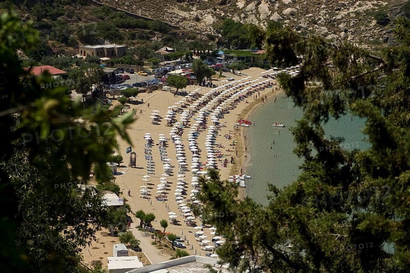 Rhodes Island, Lindos, Lindos is a town on the Greek island of Rhodes. Its landmark is the acropolis on a rock with huge archways from the 4th century and reliefs dating from around 280 BC. Full beach