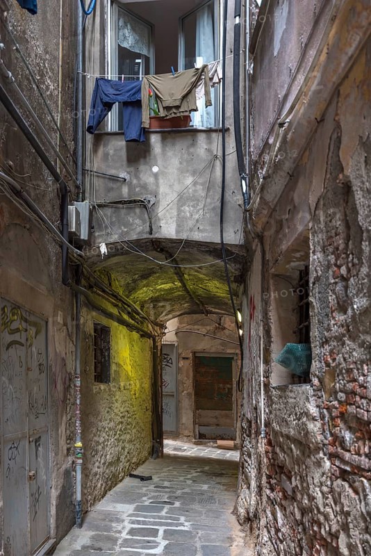 Hanging laundry in front of a window in an alley in the historic centre, Genoa, Italy, Europe