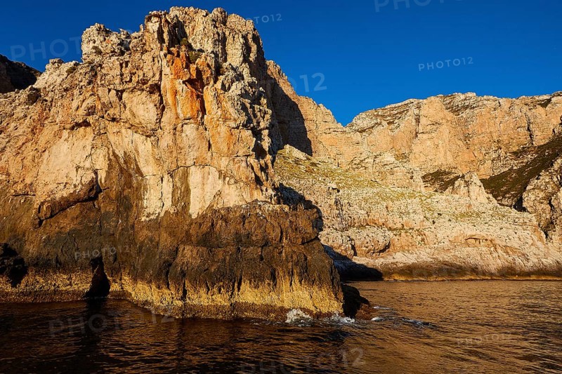 Evening light, Boat tour, View from the sea, Bizarre rock formations, Rugged mountains, Marettimo, Egadi Islands, Sicily, Italy, Europe