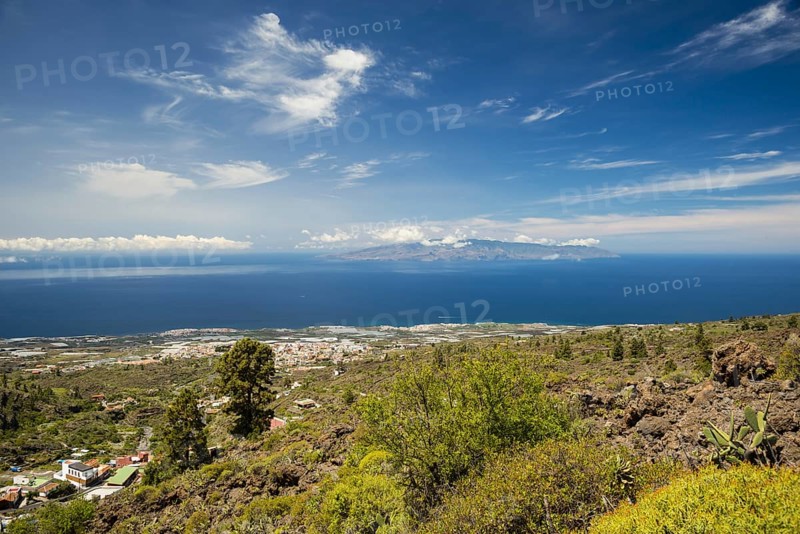 Panorama from Mirador de Chirche over Guia de Isora and Playa de San Juan to the west coast, with the island of Gomera in the background, Tenerife, Canary Islands, Spain, Europe