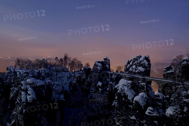 Bastei rock at full moon in winter