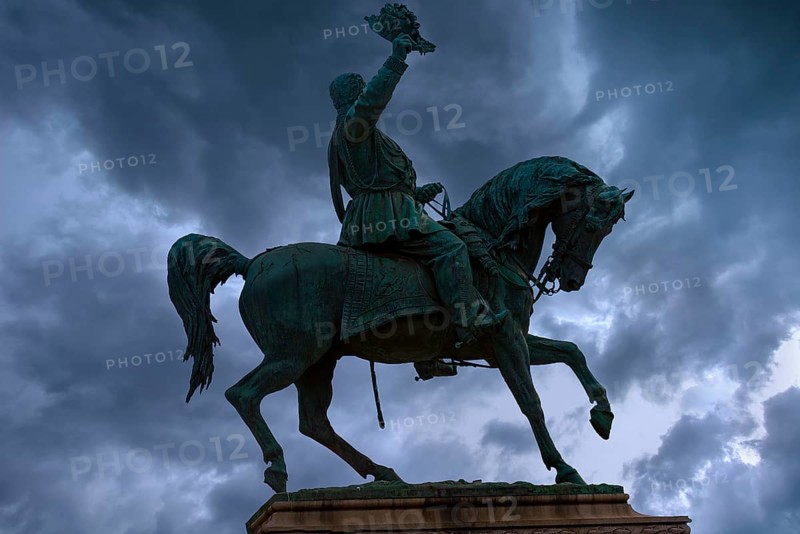 Silhouette of the equestrian statue of King Vittorio Emanuele III, rain clouds, Piazza Corvetto, Genoa, Italy, Europe
