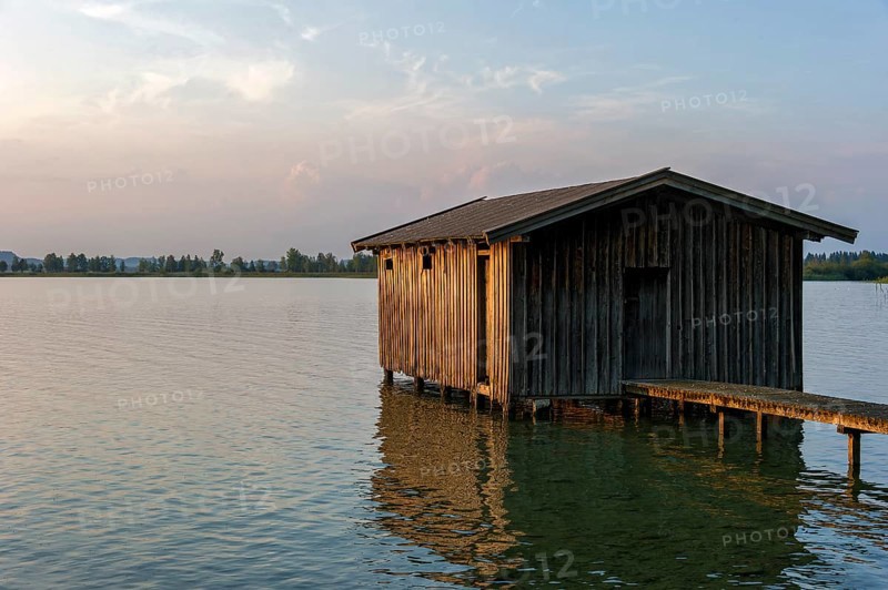 Boathouse with wooden jetty, sunset at Lake Kochel near Kochel am See, Bavarian Alpine foothills, Alps, Upper Bavaria, Bavaria, Germany, Europe