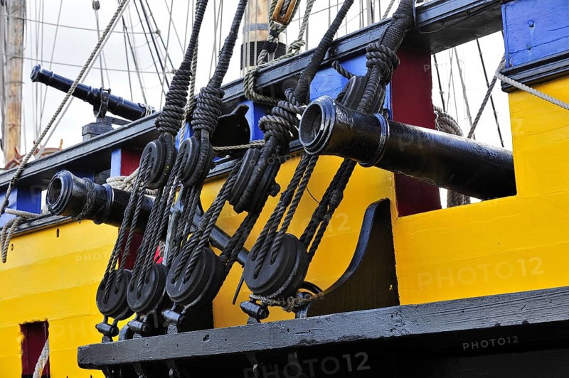 Wooden blocks and cannons on board of the Grand Turk, Etoile du Roy, a three-masted sixth-rate frigate replica of HMS Blandford, built in 1741 and based in Saint Malo, Brittany, France, Europe
