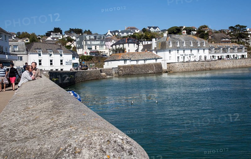 Village buildings and harbour wall, St Mawes, Cornwall, England, UK