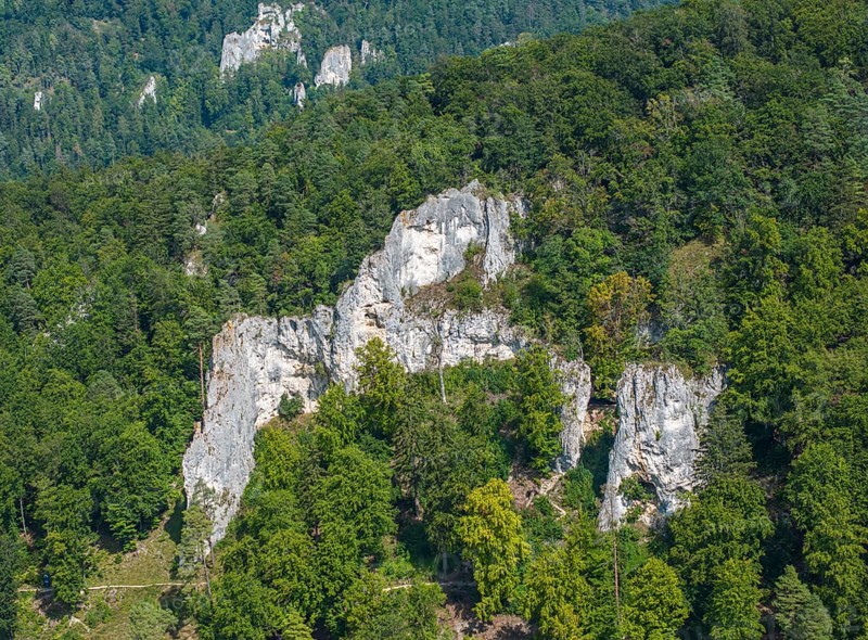 UNESCO World Heritage Caves and Ice Age Art of the Swabian Alb. Ice Age cave Geißenklösterle in the Achtal valley, site of important archaeological excavations from the Aurignacian period, drone photo. Blaubeuren, Baden-Württemberg, Germany, Europe