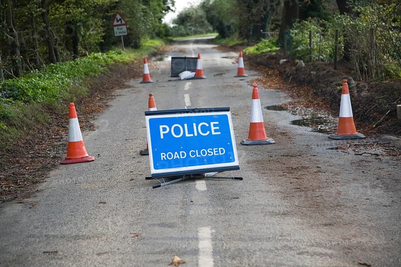 Police Road Closed sign with bollards UK Bawdsey, Suffolk, England, United Kingdom, Europe
