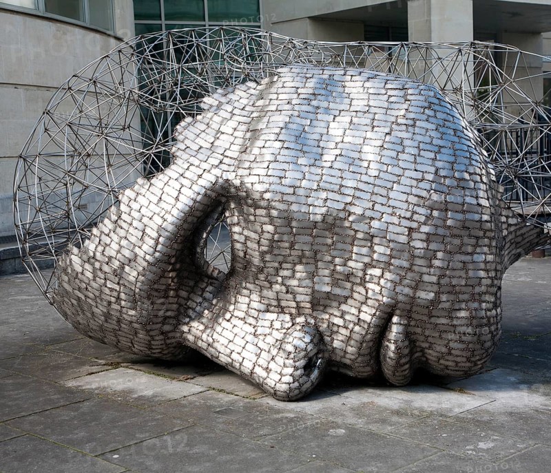 Head sculpture by artist Rick Kirby in Calne town centre, north Wiltshire, England installed in 2001