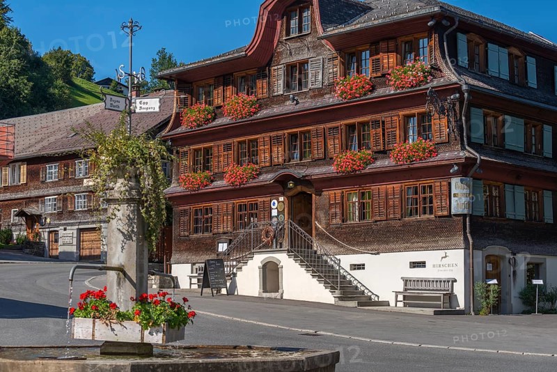 Schwarzenberg, village square with fountain, inn, Bregenz district, Bregenzerwald, wooden house, architecture, flower boxes, signposts, Voralberg, Austria, Europe