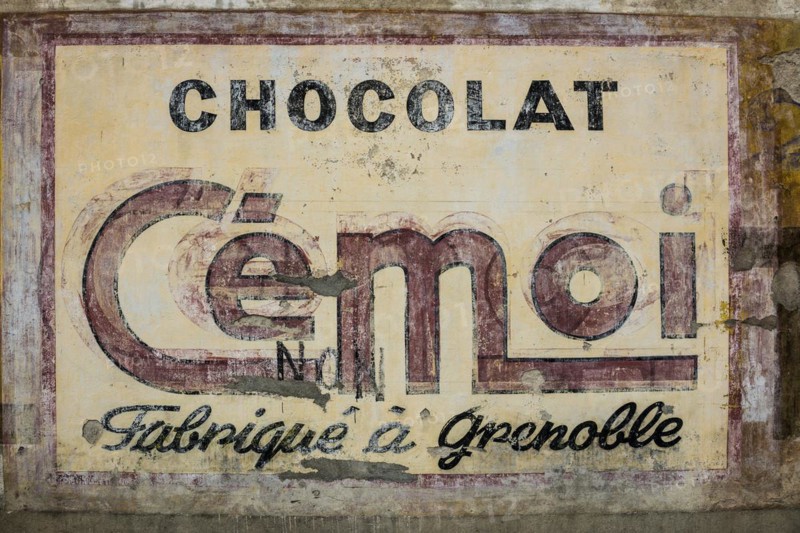 Painted house wall, weaving for chocolate, Sisteron, Provence, Provence-Alpes-Côte d'Azur region, South of France, France, Europe