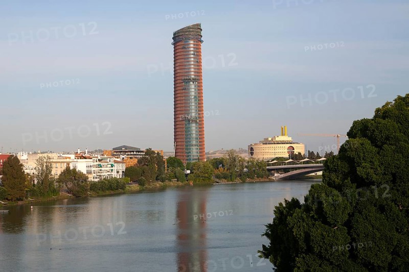 Cajasol Tower office block under construction in La Cartuja area of Seville, Spain viewed from the Guadalquivir River