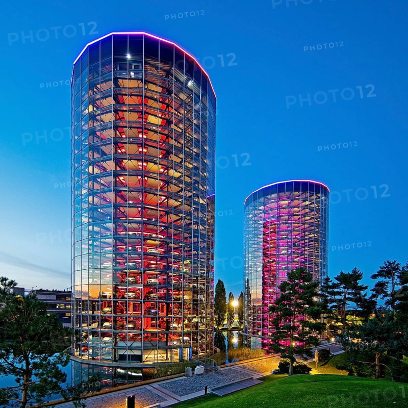The illuminated car towers with new cars for delivery in the evening, Autostadt, Volkswagen AG, Wolfsburg, Lower Saxony, Germany, Europe