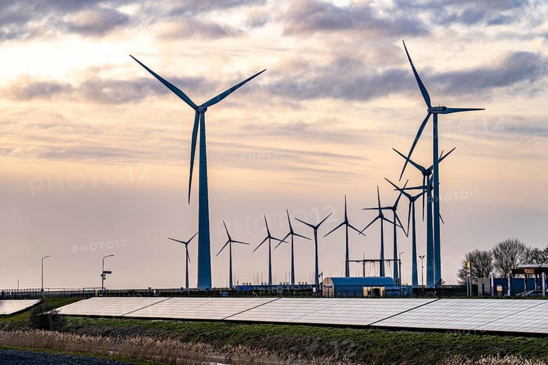 Solar park on the Slaperdijk dyke near the Eemshaven, test project, 17, 000 solar modules were installed over a good 5 kilometres, the Netherlands has over 22, 000 kilometres of dyke line, here it is being tested whether such an installation is successful and can be expanded, wind farm, Groningen, Netherlands