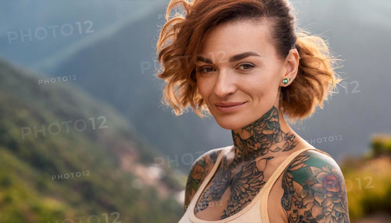 Portrait of a woman with tattoos in a natural mountain setting, radiating serenity and self-confidence, AI generated, AI generated