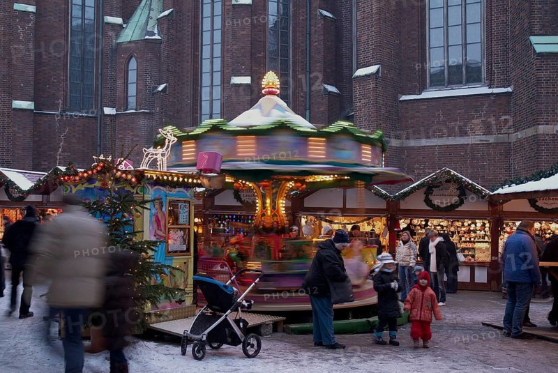 Europe, Germany, Hamburg, Christmas market in front of St Peter's Church, Children's carousel, Europe