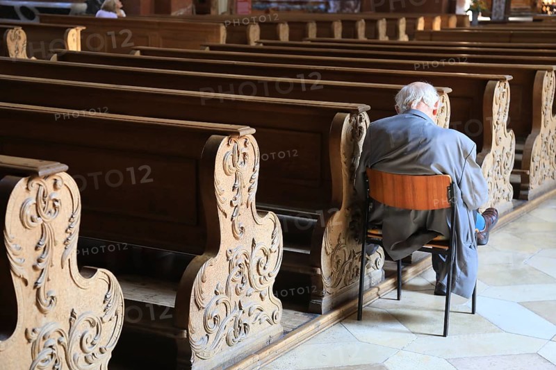 Old grey-haired man as the only churchgoer, interior of the Cistercian Abbey Church Fürstenfeld in Fürstenfeldbruck, Upper Bavaria, Bavaria, Germany, Europe
