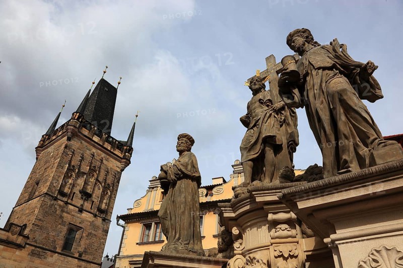 The Saints on Charles Bridge and the Lesser Town Bridge Tower, Prague, Czech Republic, Europe