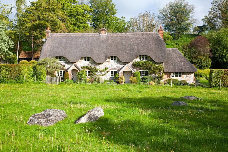 Two historic semi-detached thatched cottages at Lockeridge village, Wiltshire, England, United Kingdom, Europe