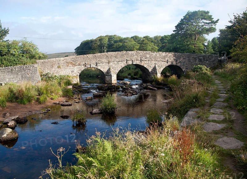 Historic Packhorse bridge at Postbridge, Dartmoor national park, Devon, England crossing the East Dart river