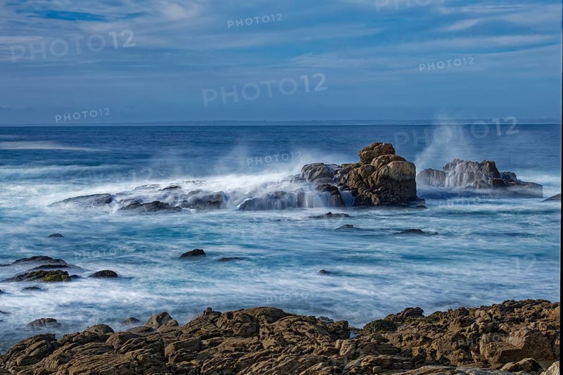 The waves of the Atlantic wash over the rocks on the coast off Penmarch in Brittany. Finistere, France, Europe