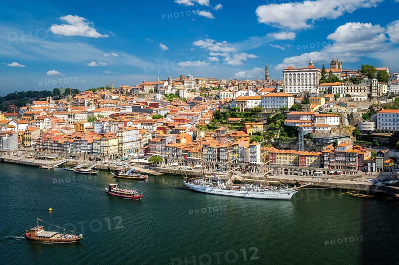 Aerial view of Porto city and Douro river with moored sailling ship from Dom Luis bridge I. Porto, Portugal, Europe
