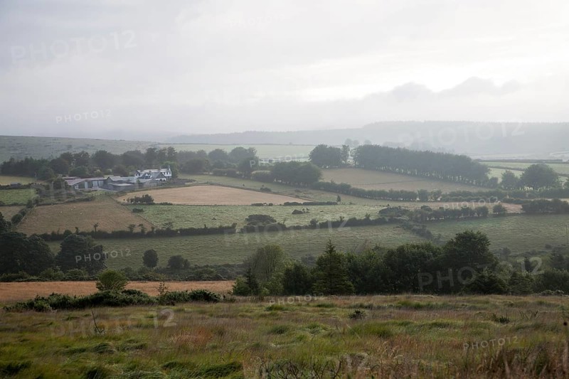 Grey overcast weather clouds hanging over moorland, Dartmoor national park, near Postbridge, Devon, England, UK