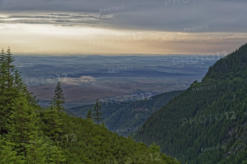 View from a slope in the Fagaras Mountains, a mountain range in the Transylvanian Alps in the southern Carpathians, to the Olt Valley in Transylvania. Sibiu, Transylvania, Romania, Southeast Europe, Europe