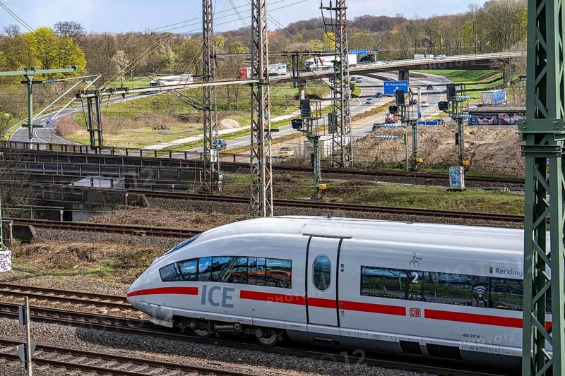 ICE train on the railway line at the Kaiserberg motorway junction, the A3 and A40, 8 tracks run parallel across the motorway junction, the Kaiserberg junction is to be completely renewed in stages, Duisburg, North Rhine-Westphalia, Germany, Europe