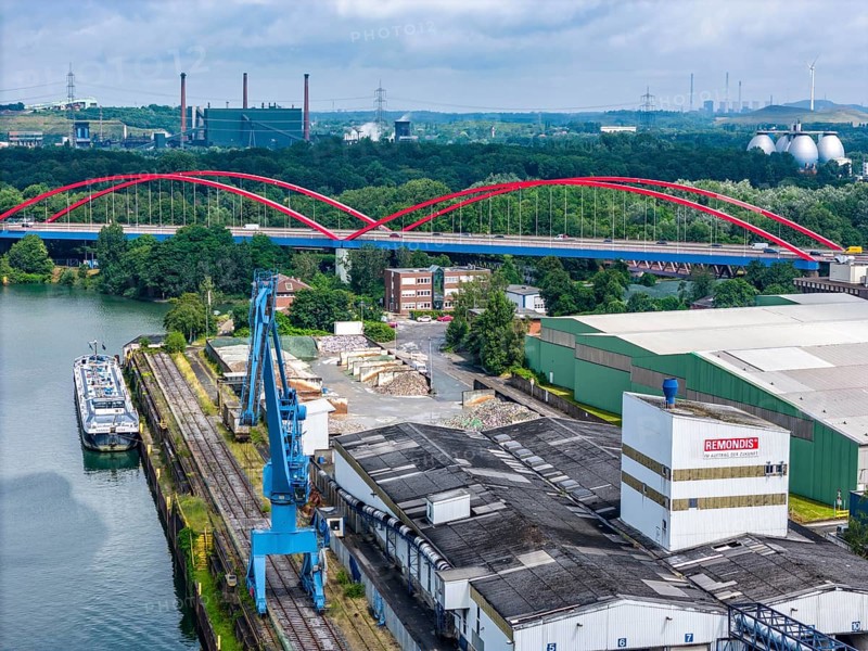 DefaultThe city harbour in the north of Essen, on the Rhine-Herne Canal, North Rhine-Westphalia, Germany, The city harbour in the north of Essen, dilapidated bridge of the A42 over the canal, ArcelorMittal's coking plant in the background, Prosper coking plant, Europe