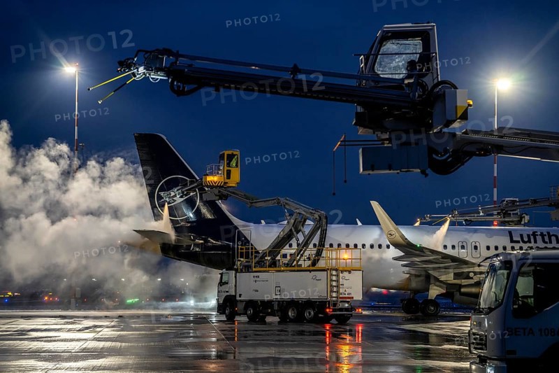 Winter at Frankfurt Main Airport, FRA, Lufthansa aircraft being de-iced by de-icing vehicles, Hesse, Germany, Europe