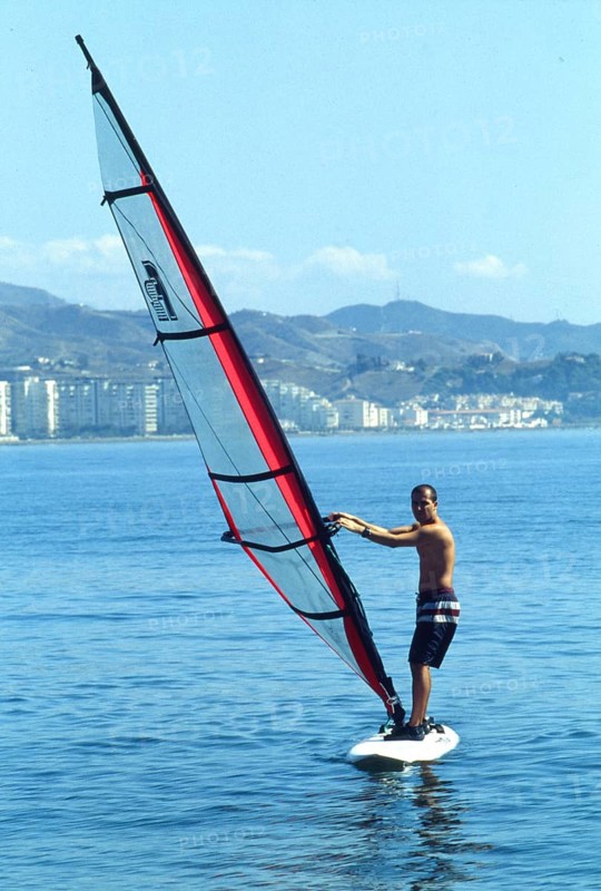 Windsurfer on calm water in Calella, Costa Brava, Barselona, ??Catalonia, Spain, Southern Europe. Scanned thumbnail slide, vintage, retro, funny, Europe