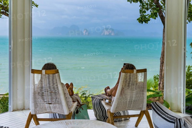 View of Phang Nga bay near Koh Yai Noi, seascape, seascape, nature, natural landscape, chalk cliffs, rocks, rocky, cliffs, lagoon, cloud, cloudy sky, sky, panorama, limestone, sandstone, holiday, travel, tourism, beach holiday, beach holiday, sun, sunny, climate, water, sea, ocean, coast, coastal landscape, paradise, holiday paradise, paradisiacal, boat, island, dream holiday, symbolic, Asian, exotic, beautiful, view, terrace, tourist, hotel, seat, Phangnga, Phuket, Thailand, Asia