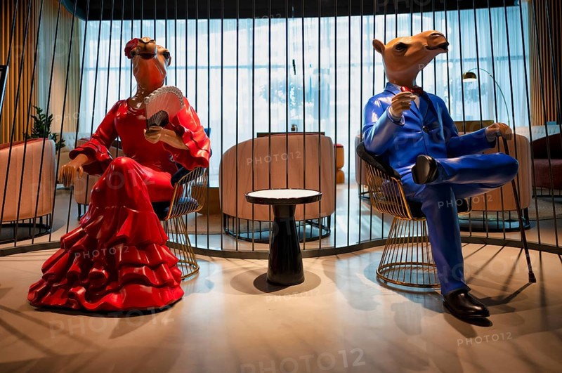 Interior view lobby, two camel figures waiting, sitting on chairs, Hotel NH Collection The Palm Jumeirah, Dubai, United Arab Emirates, VAR, Asia