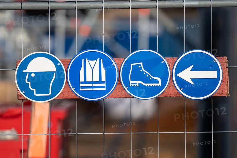 Construction site, safety signs, wear a helmet, high-visibility waistcoat, safety shoes, work safety