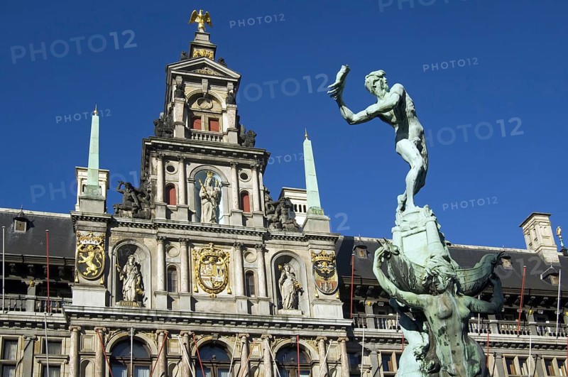 City hall and fountain statue of Silvius Brabo throwing the giant's hand at the Grote markt, Town Square, Antwerp, Belgium, Europe