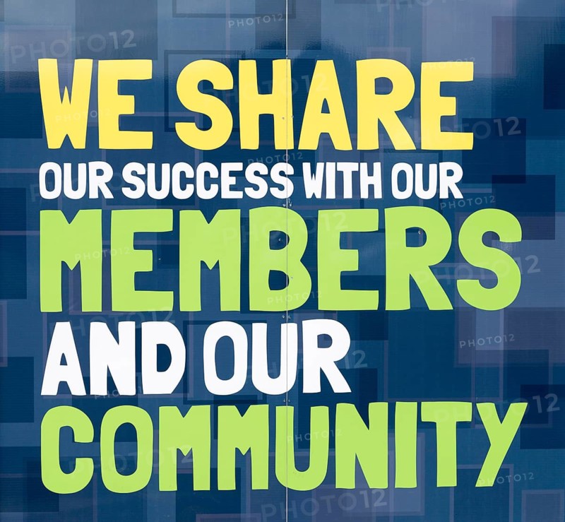 We Share Our Success With Our Members and Our Community, East of England Co-operative Society shop advertising boards hoardings, Woodbridge, Suffolk, UK