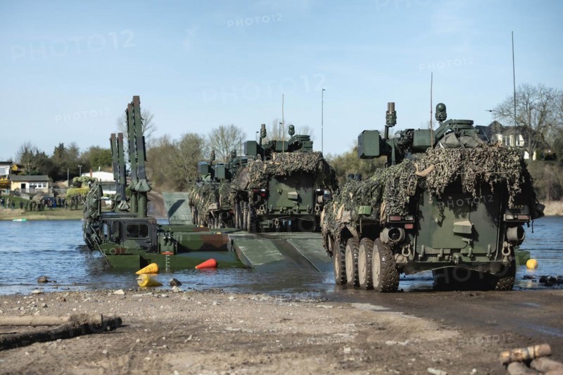 Pandur wheeled tanks of the Czech army drive onto German Bundeswehr vehicles of the Amphibie M3 type as part of the multinational military exercise 'Wettiner Schwert' near Tangermünde, 26.03.2024. 'Wettiner Schwert' is part of the Quadriga exercise of the Bundeswehr and the NATO large-scale manoeuvre Steadtfast Defender 2024