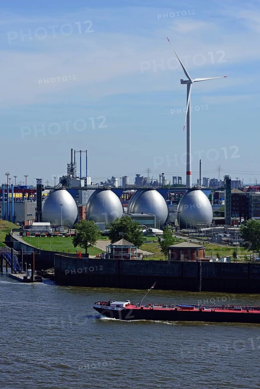 Europe, Germany, Hamburg, Köhlbrandhöft sewage treatment plant, view of the digestion towers, Elbe with paddle steamer, in the background Altenwerder wind energy plant, Hamburg, Hamburg, Federal Republic of Germany, Europe