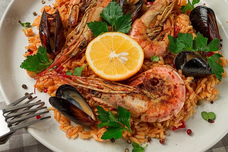 Seafood paella, shrimp and mussels risotto, rice, homemade, top view, no people